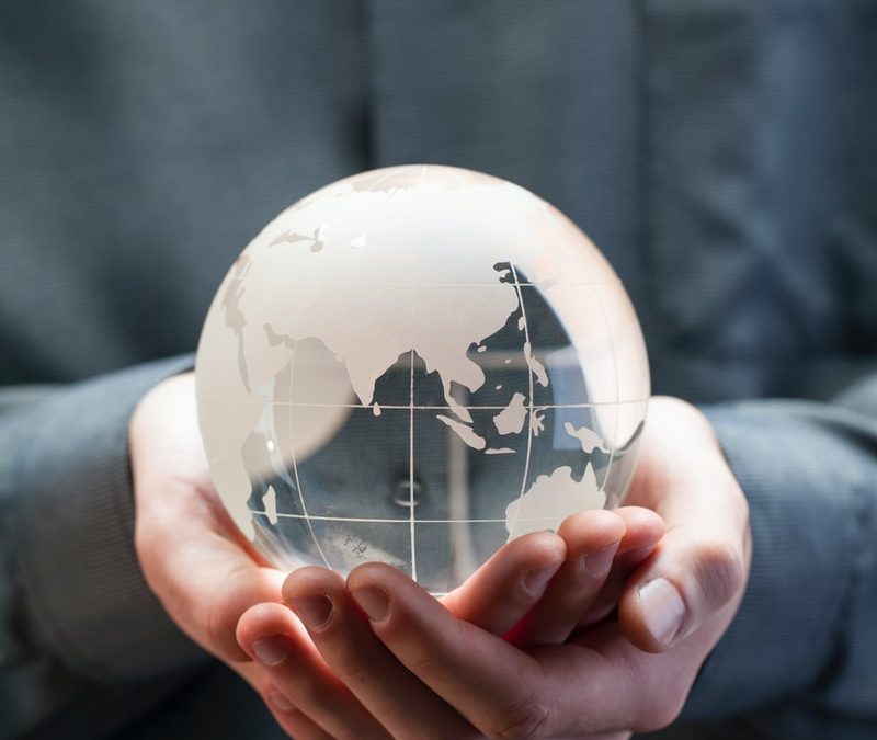 shallow focus photo of clear glass globe table ornament