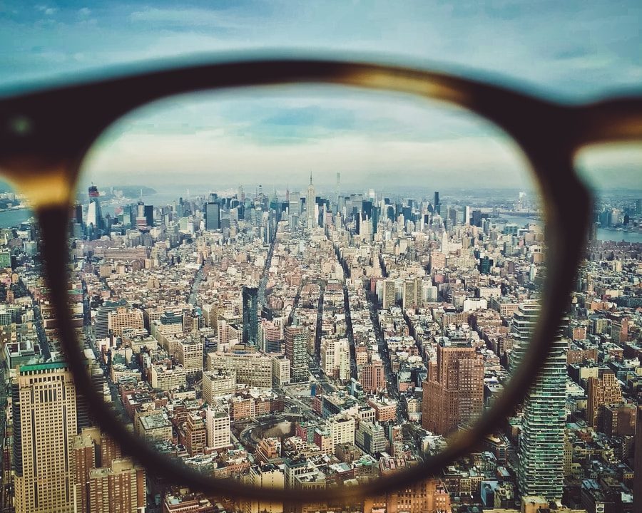 city buildings on eyeglasses view
